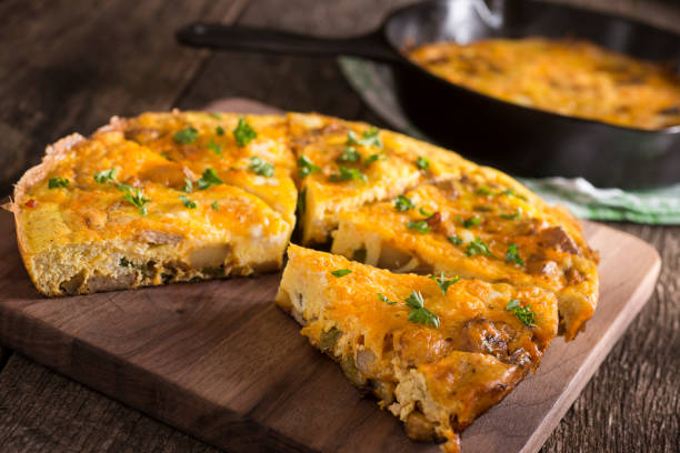 omelet Frittata in Cast Iron with Sausage and Cheese frittata stock pictures, royalty-free photos & images