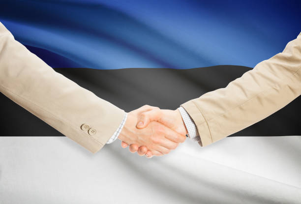 istock Businessmen handshake with flag on background - Estonia 685775920