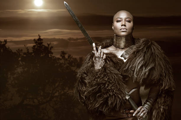 istock Beautiful black warrior princess holding a sword in studio shot 685776260
