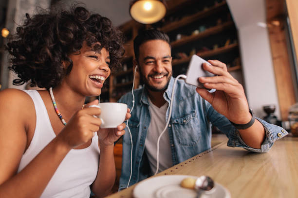 istock Man showing something on cellphone to his girlfriend 685776468