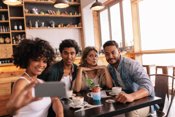 istock Small group of friends taking selfie at cafe 685776614