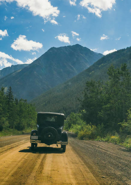 istock Classic Car on Dirt Road 685778322