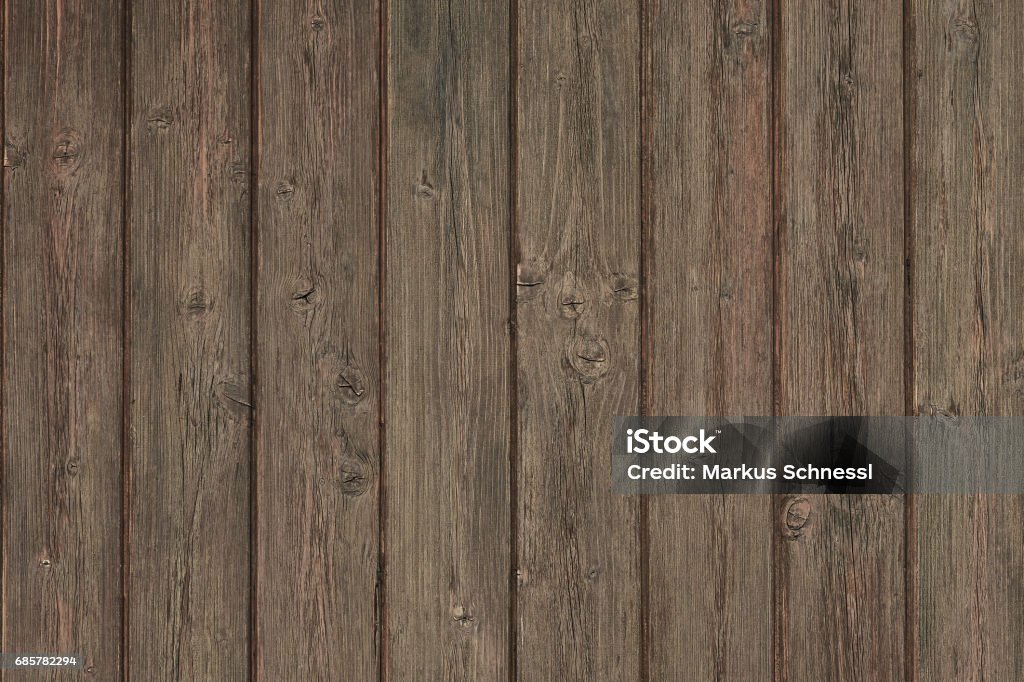 worn wall made of wooden planks background texture Austria Stock Photo