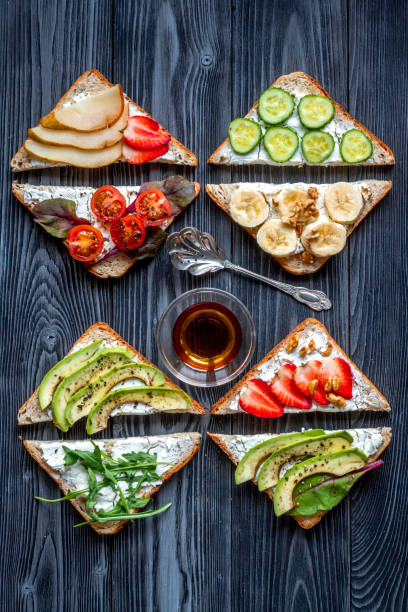 istock sandwiches set on dark table background top view 685784082