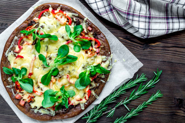 istock vegetarian pizza on wooden table background top view 685785206