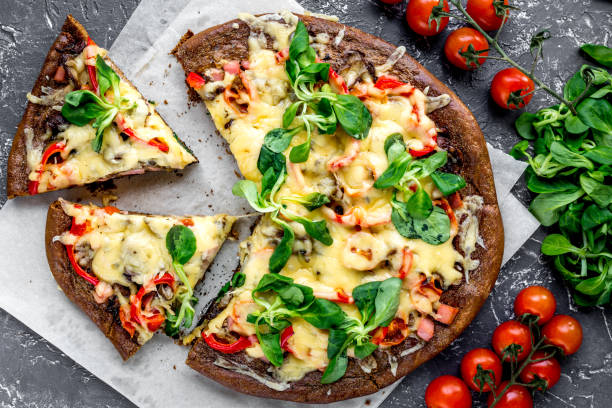 istock cooking pizza with vegetables and cheese on stone desk background top view 685785280