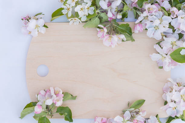 istock wooden cutting board and apple flowers 685785892