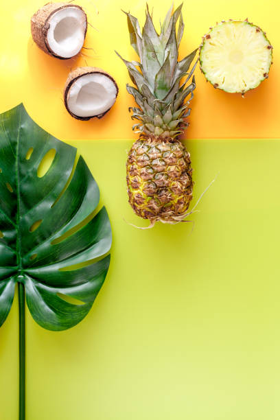 istock summer dessert with pineapples and coconut on yellow background top view mock up 685786570