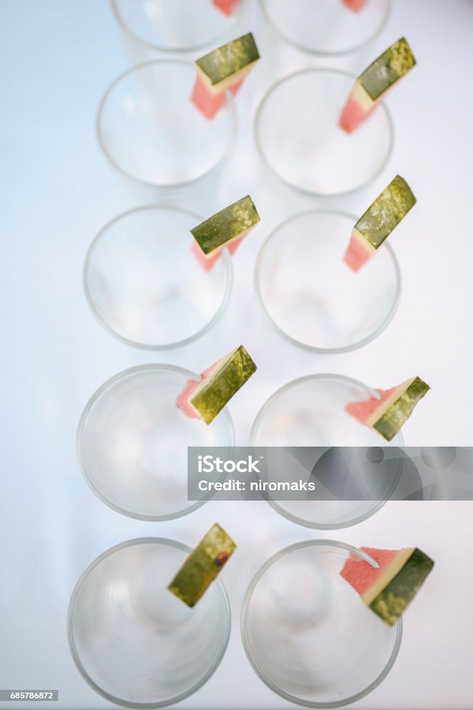 Rows of empty glasses prepared for reception Alcohol - Drink Stock Photo