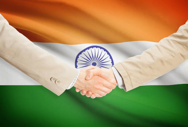 istock Businessmen handshake with flag on background - India 685787018