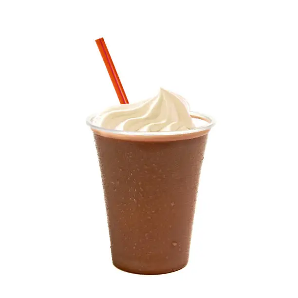 Chocolate milkshake with cream and straw on white background