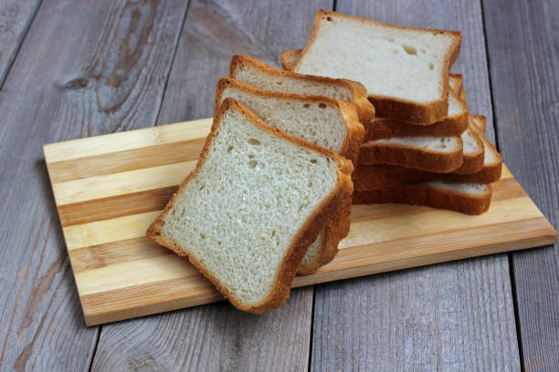 istock pieces of wheat bread on a cutting Board. 685795600