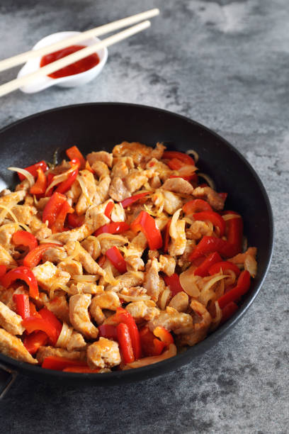 istock Fried pork with red peppers and Asian sauce 685798616