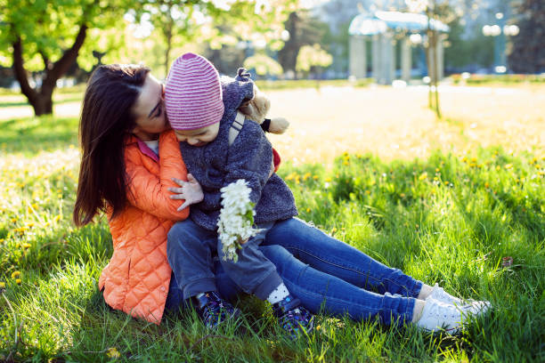 istock Mother and a child hugging in the park 685801386