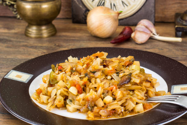 istock Fried cabbage with onions and paprika on plate 685802036