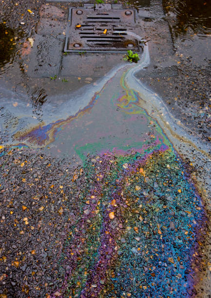 istock Petrol Oil In Water Running Down the Drain 685804686