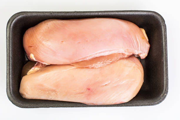 istock Chicken breast fillets raw in food packaging tray 685804778