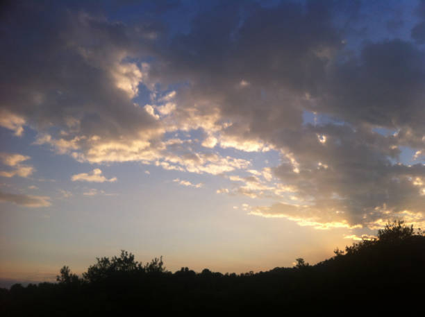 istock golden sunset clouds over the hill 685805618