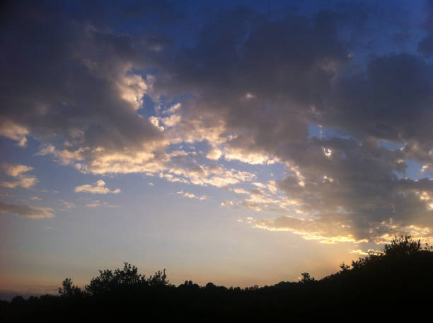 istock golden sunset clouds over the hill 685805694