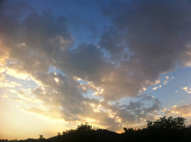 istock golden sunset clouds over the hill 685805890