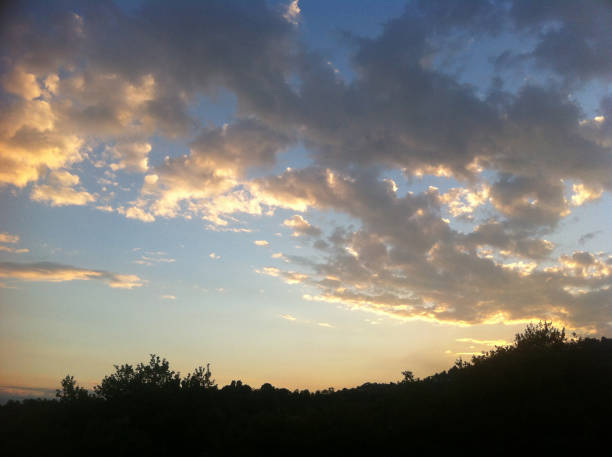 istock golden sunset clouds over the hill 685805934