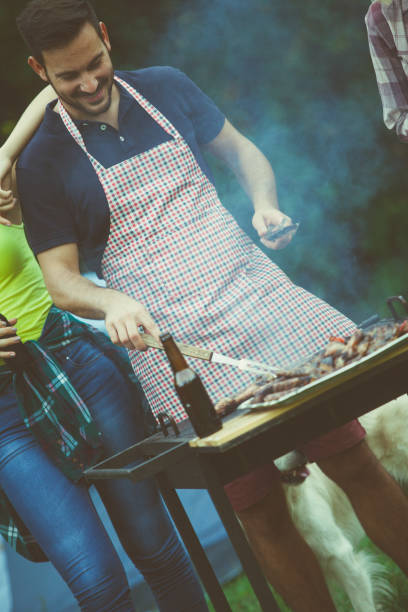 istock Master for barbecue preparing lunch for friends 685806538