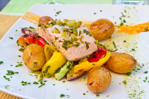 istock Salmon fillet with potatoes and vegetable 685807208