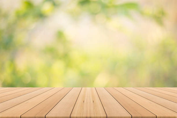 istock table top on green blurred  background,Space for placing products 685807852