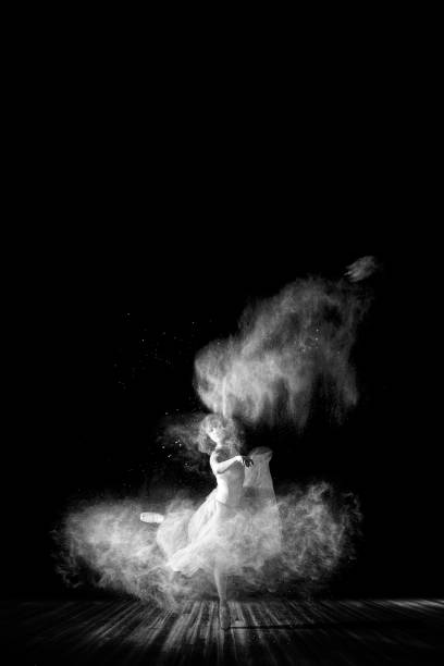istock Beautiful ballet dancer, dancing with powder on stage 685809544