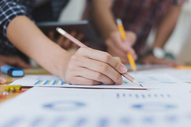 istock startup young successful team on meeting in modern office interior brainstorming, make a business plan, working on financial and marketing graph and chart 685809780