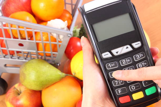 istock Using payment terminal, fruits and vegetables, cashless paying for shopping, enter personal identification number 685815014