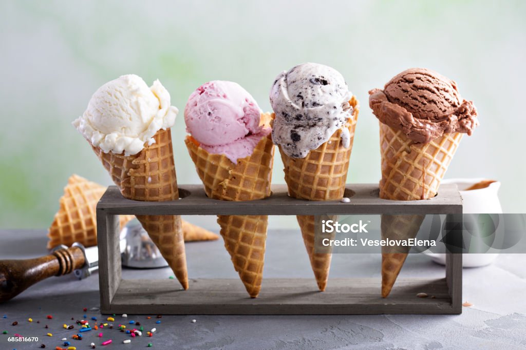 Variety of ice cream cones Variety of ice cream scoops in cones with chocolate, vanilla and strawberry Ice Cream Stock Photo