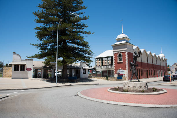 Fremantle Oval and Statue Fremantle,WA,Australia-November 13,2016: Fremantle Oval ticket booth entrance with other architecture and traffic circle with sports statue in Fremantle,Western Australia. fremantle oval stock pictures, royalty-free photos & images