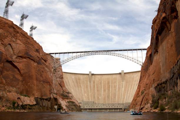 Glen Canyon Dam On The Colorado River Glen Canyon Dam on the Colorado River with Highway 89 bridge passing over the chasm near the city of Page Arizona glen canyon dam stock pictures, royalty-free photos & images