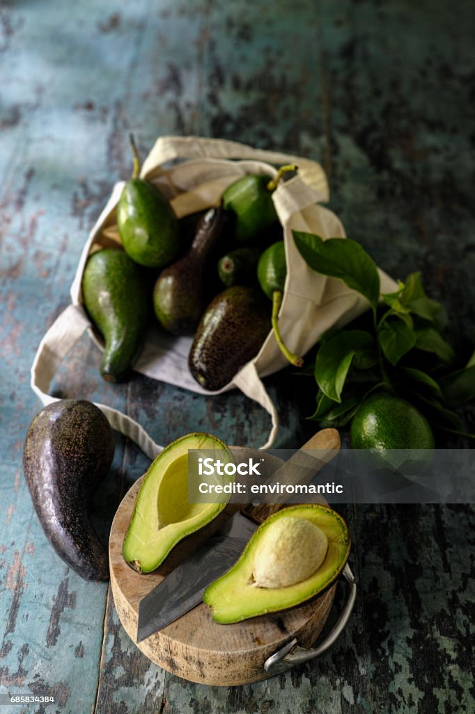 https://media.istockphoto.com/id/685834384/photo/fresh-market-avocado-cut-in-half-on-a-wooden-cutting-board-next-to-a-knife-with-more-avocados.jpg?s=1024x1024&w=is&k=20&c=mH49kX_96lZo3nvDXqblE8Jrkwhy-GqduBqtpr7kWCo=