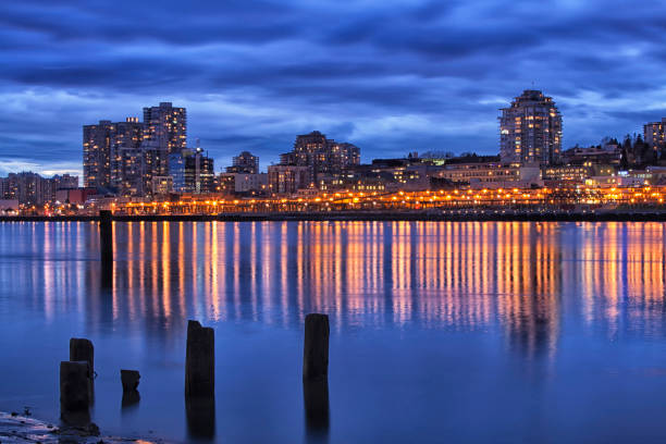 New Westminster cityscape reflection in Fraser river in winter.