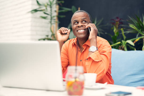 istock Afro american businessman talking on mobile phone 685839752