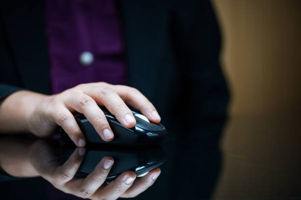 istock Close-up of businesswoman's hand on computer mouse 685839908