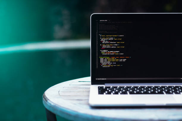 istock laptop on a wooden table against the background 685840730