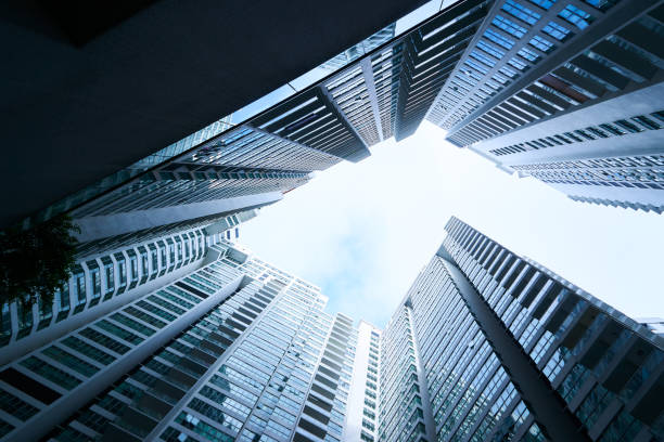 istock Abstract low angle view of common modern business skyscrapers.Multistoried modern and stylish living block of flats. Real estate and new house. 685841466