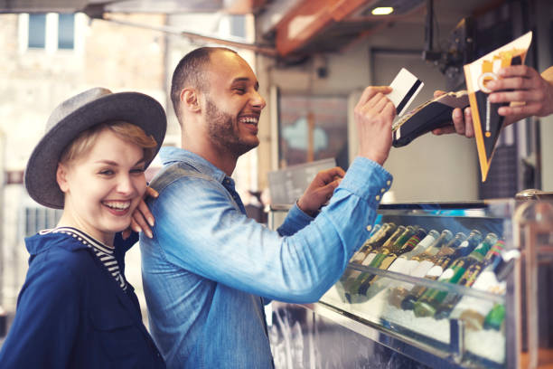 istock Young man doing contactless payment for fries 685841738