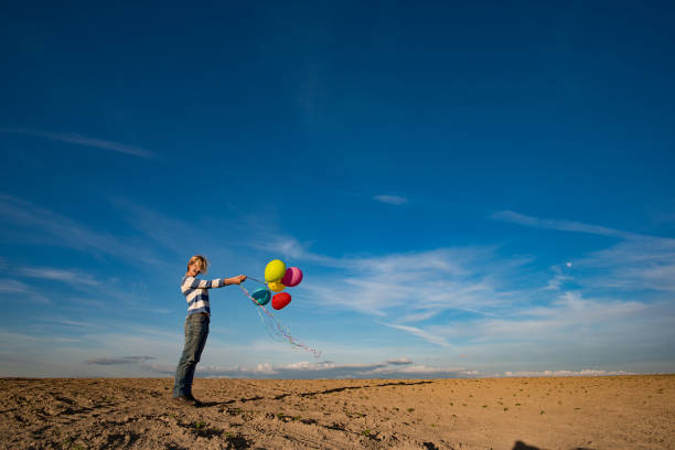 istock Woman and toy balloons 685842268