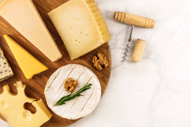 istock Selection of cheeses with corkscrew, cork, and copyspace 685842394