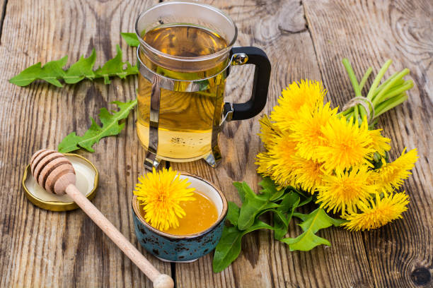 istock Herbal tea and honey from dandelions on wooden background 685844970