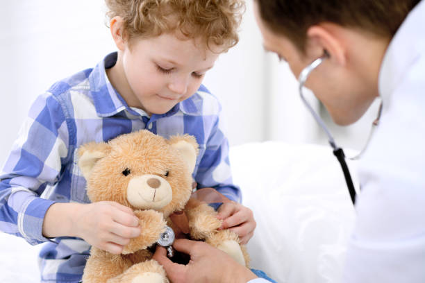 istock Doctor examining a child  patient by stethoscope 685845324