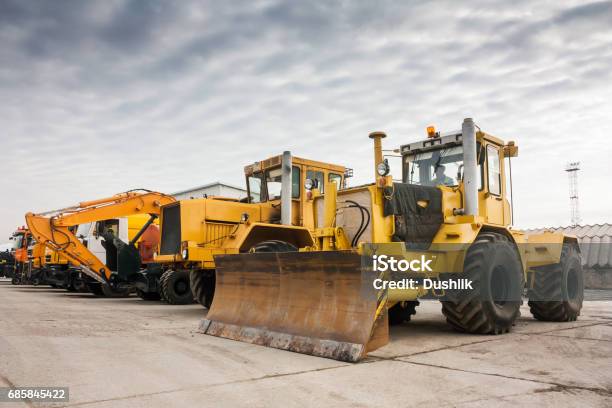 Two Heavy Wheeled Tractor One Excavator And Other Construction Machinery Stock Photo - Download Image Now