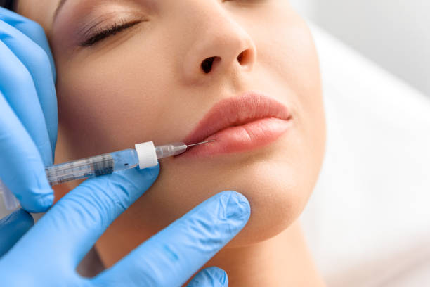 istock Serene woman enduring ache from syringe in clinic 685845632