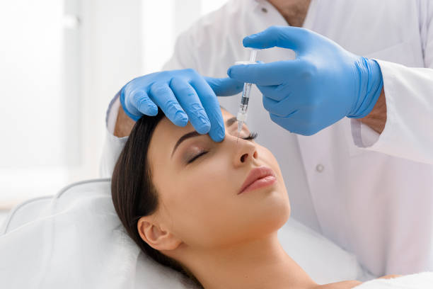 istock Serene woman receiving injection in face 685845814