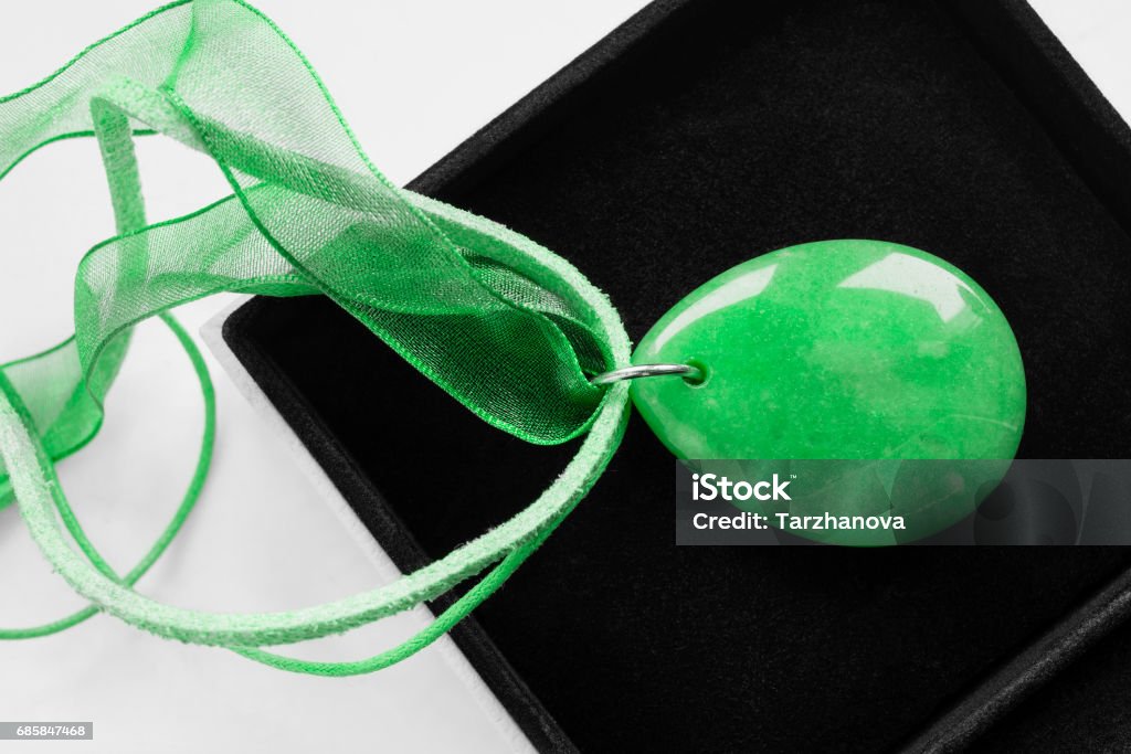 Necklace in a box Green nephrite necklace in black jewel box closeup Arts Culture and Entertainment Stock Photo