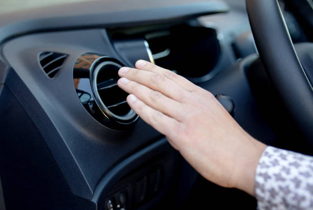 istock Driver hand on air ventilation grille with power regulator, modern car interior detail 685847534